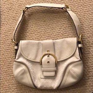 Very light gold shoulder purse by Coach